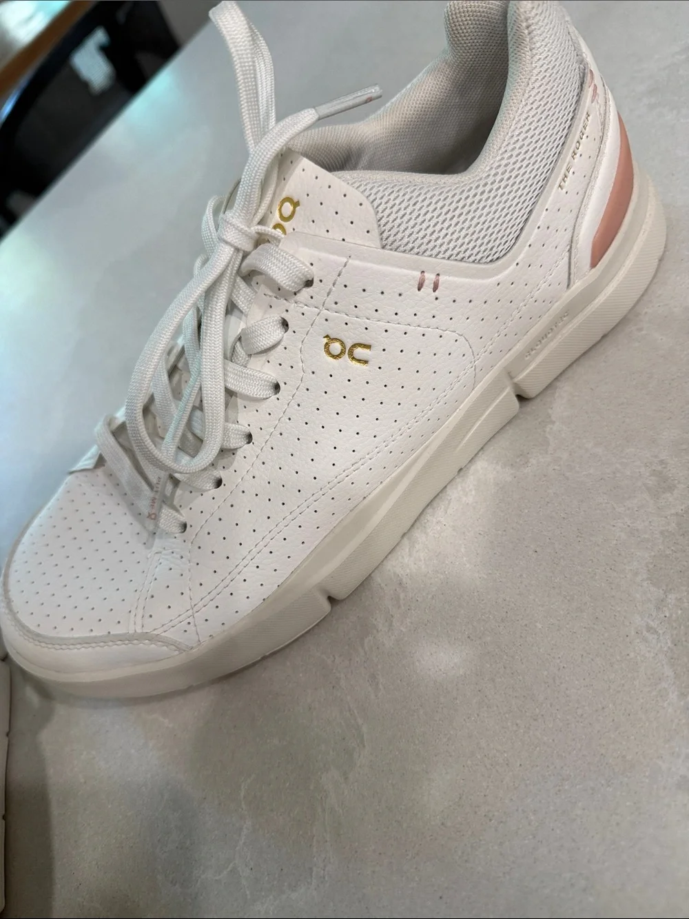 On Cloud . The Roger  Women's Perforated Leather Sneakers